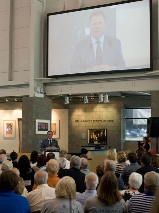 Brian Kelly addresses an overflow crowd at the dedication of the Kelly Family Sports Center on the campus of Grand Valley State University