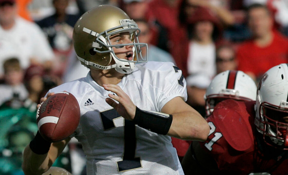 Notre Dame quarterback Jimmy Clausen throws under pressure from Stanford defensive end Pannel Egboh in the first half.(AP Photo/Marcio Jose Sanchez)