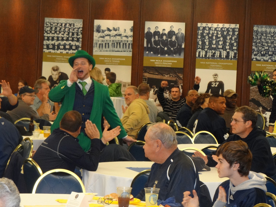 The Leprechaun and cheerleaders make an appearance at every Monogram Club pre-game reception, which begins three hours prior to kickoff.