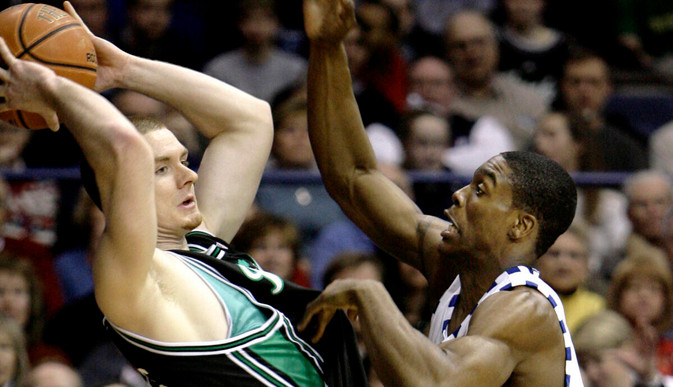 Colin Falls looks to a pass against DePaul's Karron Clarke during the first half. (AP Photo/Nam Y. Huh)