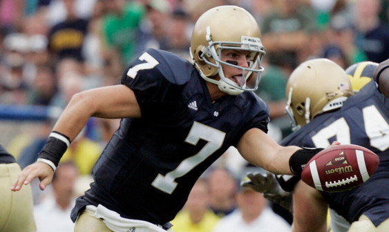 Jimmy Clausen looks to hand off the ball in the first quarter. (AP Photo/Michael Conroy)