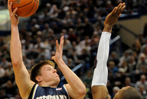Luke Harangody shoots over Connecticut's Alex Oriakhi during the second half. (AP Photo/Fred Beckham)