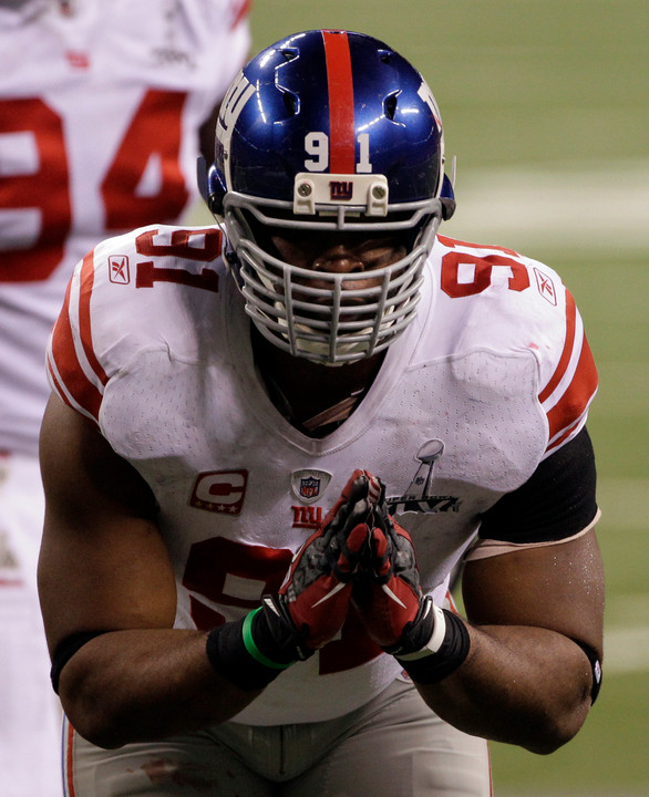 Former Notre Dame defensive end Justin Tuck tallied two sacks and forced a safety to help the N.Y. Giants defeat the New England Patriots in Super Bowl XLVI