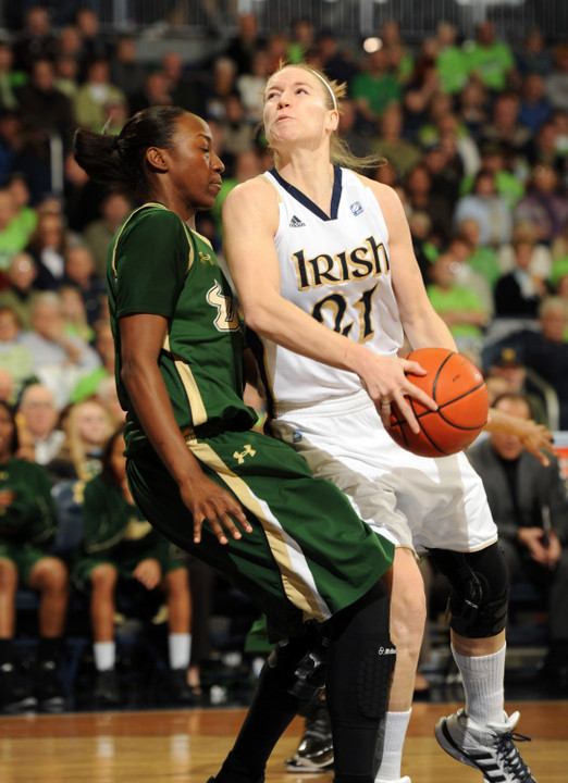 Natalie Novosel drives the lane as South Florida's Tahira Johnson defends.
