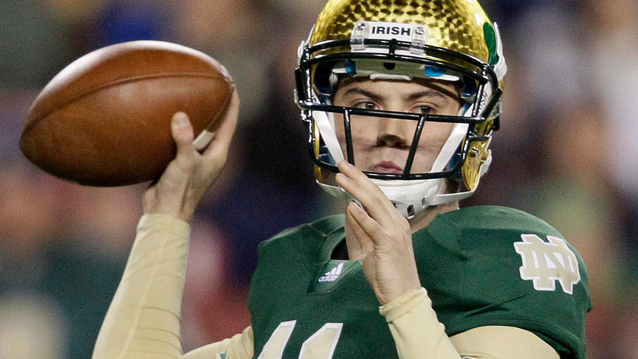 Notre Dame quarterback Tommy Rees throws to a receiver.