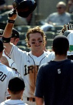 Matt Edwards is greeted by his teammates after scoring the first run in the winners-bracket win over Pittsburgh (photo by Pete LaFleur).