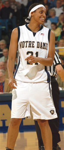 Jacqueline Batteast smiles after she scores a basket and was fouled during second half action.