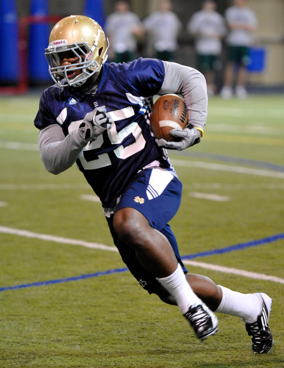 Running back Jonas Gray and his teammates ended up in pads for the first time this spring today.