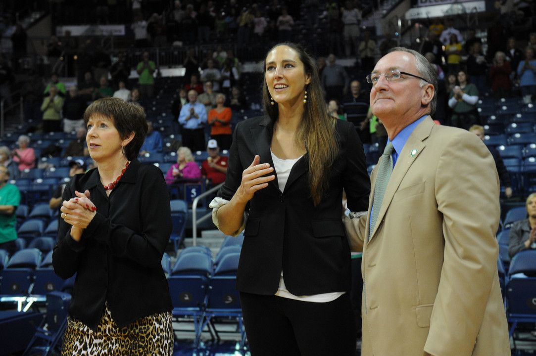 Ruth Riley '01 looks on with athletics director Jack Swarbrick as her name is added to Purcell Pavilion's prestigious Ring of Honor.