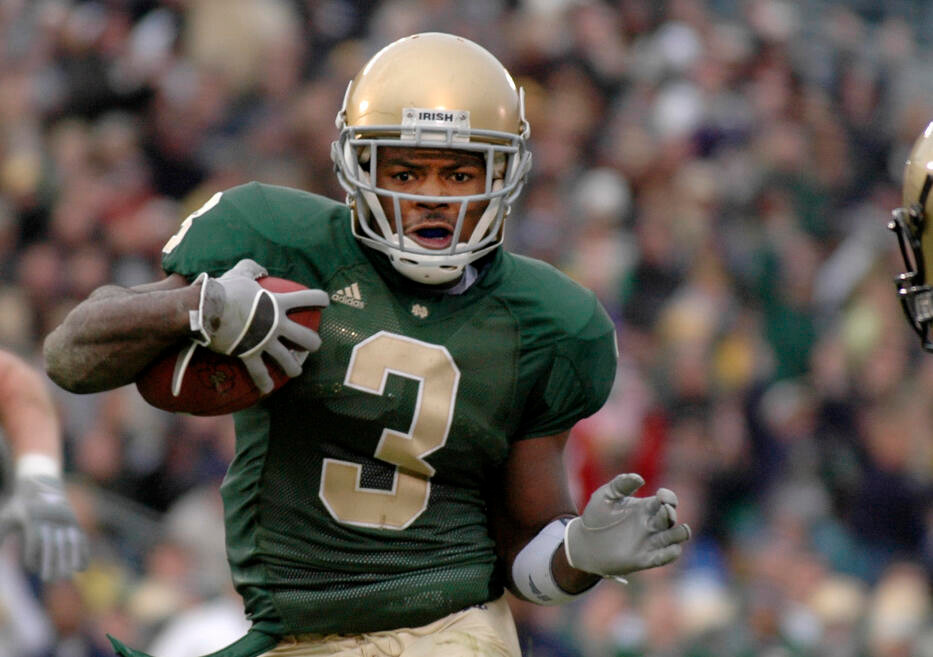 Darius Walker runs for a 10-yard touchdown in the first quarter. (AP Photo/Joe Raymond)