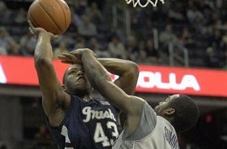 Russell Carter goes to the basket during the first half.