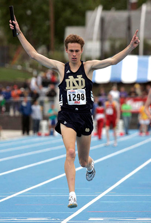 Junior Kurt Benninger celebrates as he crosses the finish line after running the anchor leg for Notre Dame's victorious 4 x 1,600-meter relay team at the Drake Relays on Friday in Des Moines, Iowa. <i>(photo courtesy of Des Moines Register)</i>