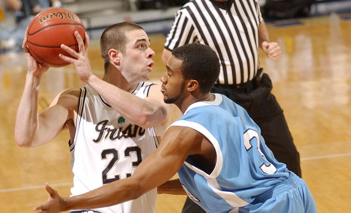 Kyle McAlarney drives the lane against Columbia guard Kashif Sweet during the first half.  (AP Photo/Joe Raymond)