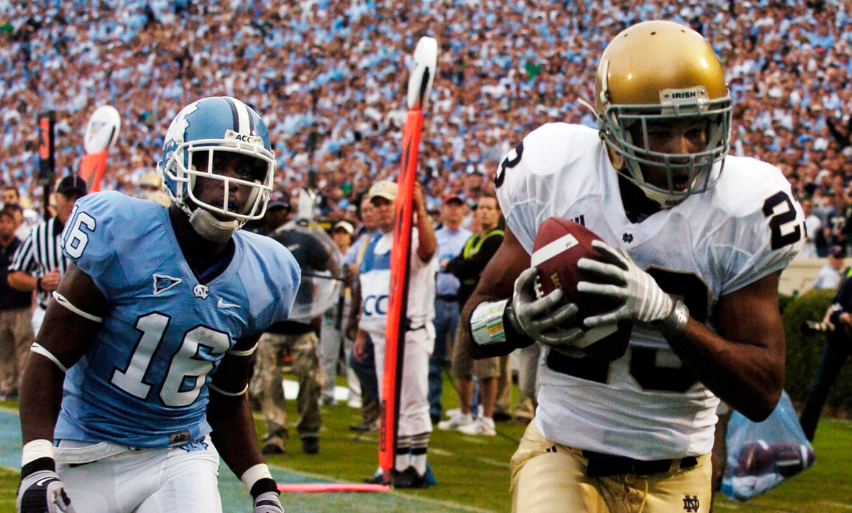 North Carolina's Kendric Burney follows Golden Tate into the end zone for Notre Dame's first touchdown. (AP Photo/Sara D. Davis)