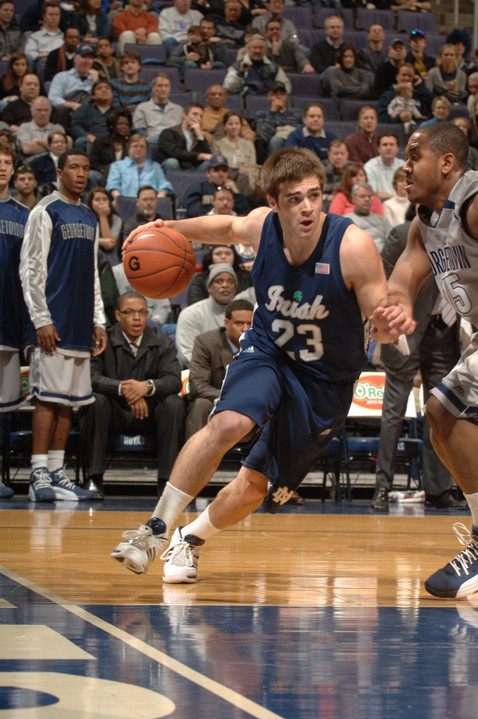 Kyle McAlarney drives down the court.