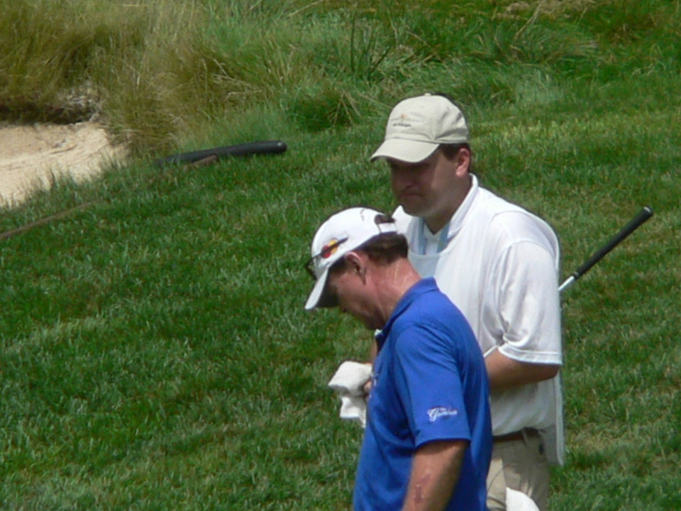 Notre Dame men's golf coach Jim Kubinski (white shirt) served as Tom Watson's caddy on August 10 at the opening of the Harbor Shores Golf Club in Benton Harbor, Mich.