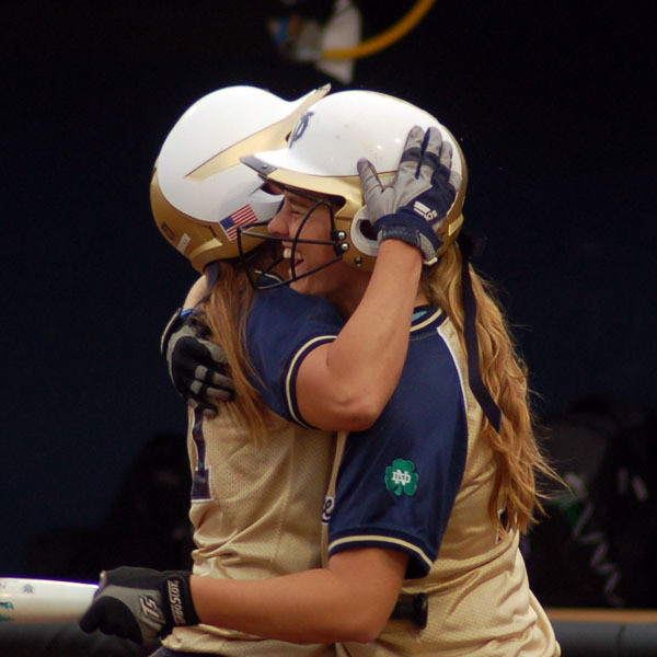 Linda Kohan (left) and Beth Northway celebrate after Kohan scored the game-winning run in game one Thursday night against Loyola.