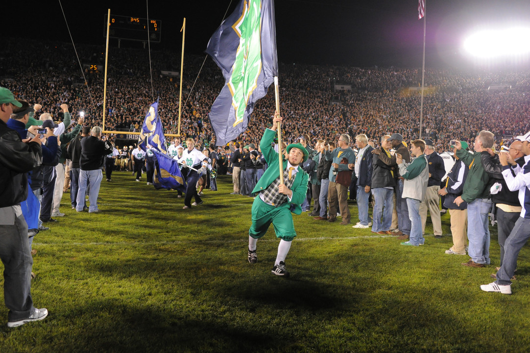 Football Monogram winners formed the on-field tunnel prior to the game against the Trojans (photo by Mike Bennett).