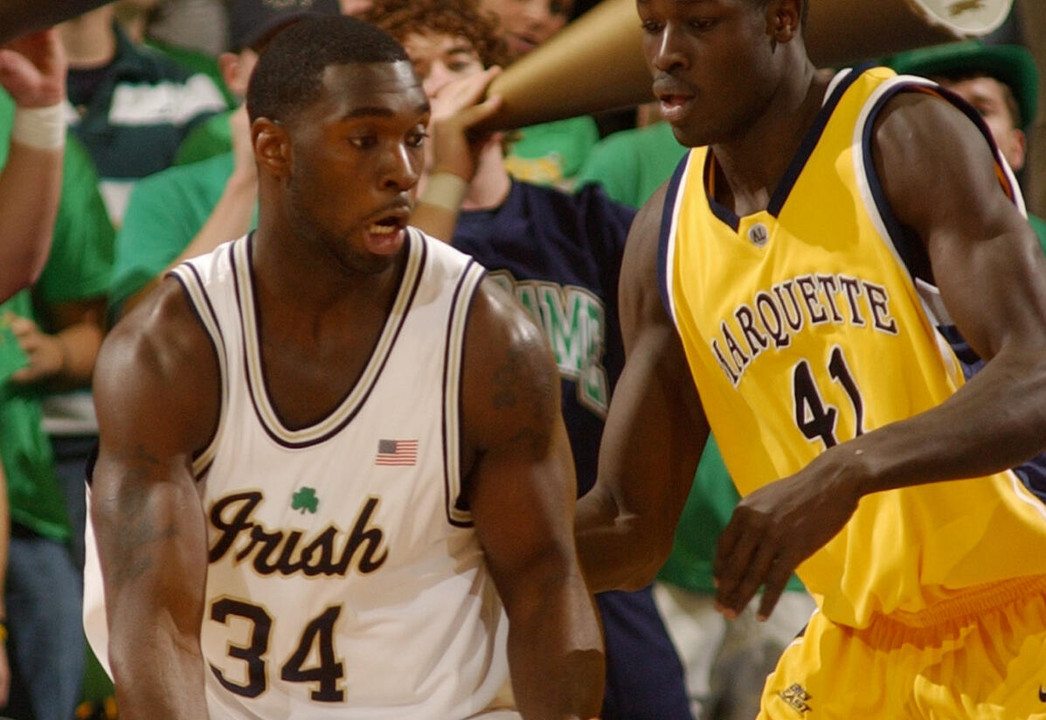 Notre Dame forward Torin Francis (34) drives the lane against Marquette forward Ousmane Barro (41). (AP Photo/Joe Raymond)