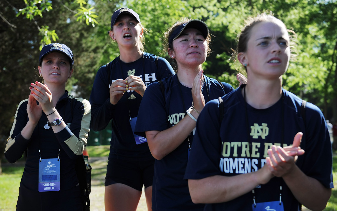 Notre Dame first varsity eight coxswain Christina Dines cheers teammates on from the shore on Saturday at the NCAA Championship