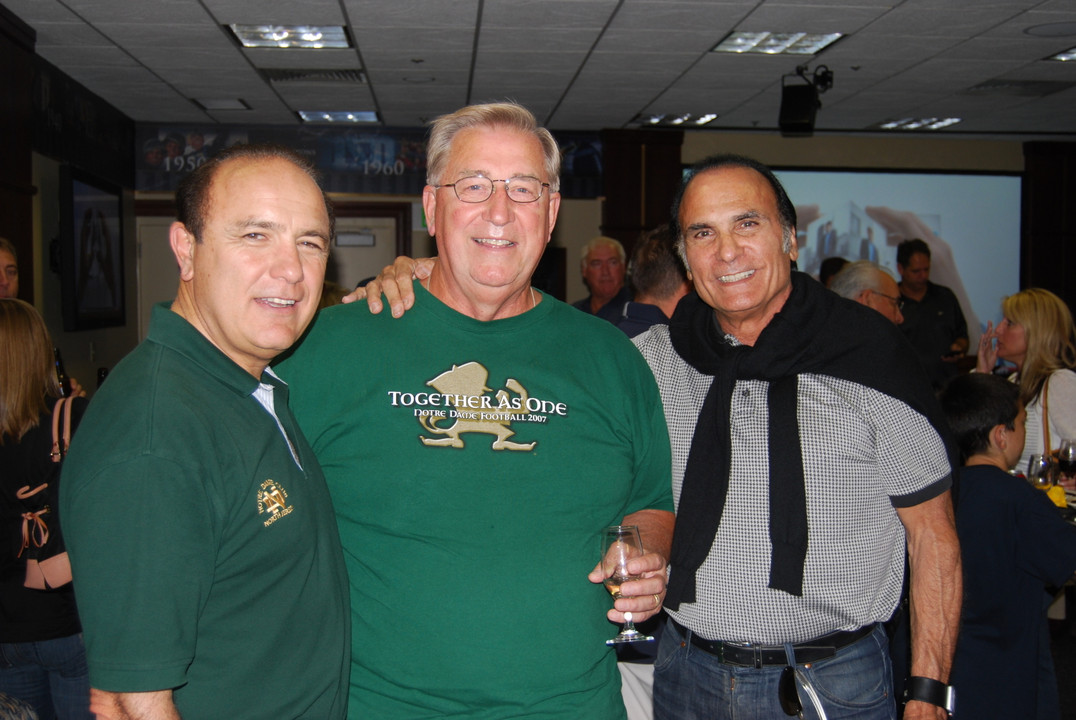 Football Monogram winners enjoying a Friday night reception.