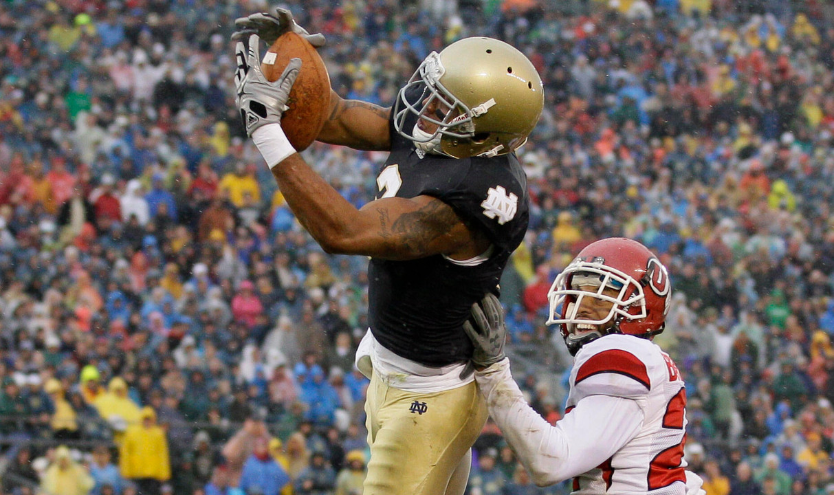 Notre Dame wide receiver Michael Floyd makes a 3-yard touchdown reception while being defended by Utah cornerback Brandon Burton.