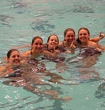Irish swimmers (from left) Katie Guida, Katie Carroll, Kelly Battle, Ellen Johnson, and Rebecca Grove celebrate Notre Dame's victory.