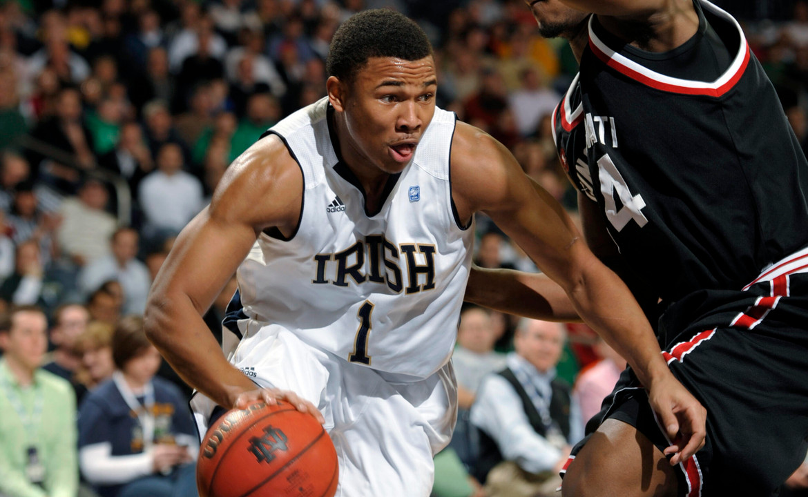Notre Dame forward Tyrone Nash drives the lane as Cincinnati forward Yancy Gates defends.