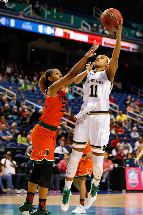 Brianna Turner shoots against Miami (FL) Hurricanes forward Erykah Davenport.