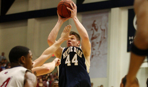 Luke Harangody shoots the ball with a hand in his face. (AP)