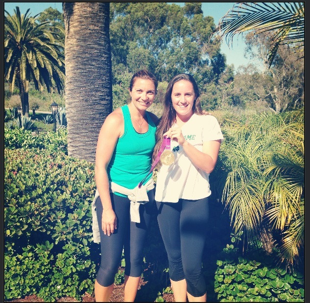 Sammie Brown (right) poses with three-time Olympic gold medalist Misty May-Treanor.