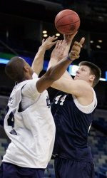 Carleton Scott (left) and Luke Harangody (right) battle under the boards during Notre Dame's open practice on March 17, 2010 in New Orleans.