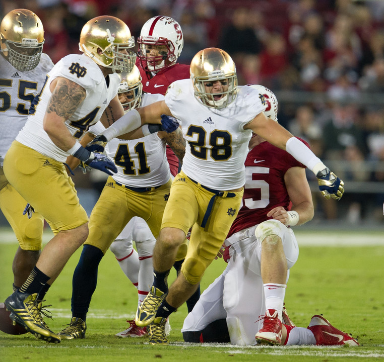 Notre Dame Safety Austin Collinsworth celebrates after an interception.