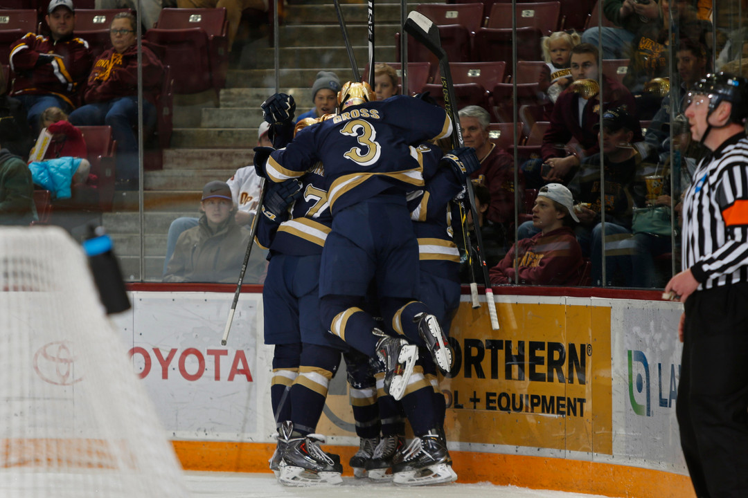 The Irish celebrate Austin Wuthrich's second-period goal versus Minnesota.