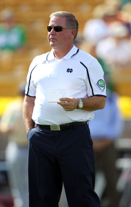 Brian Kelly watches his team.