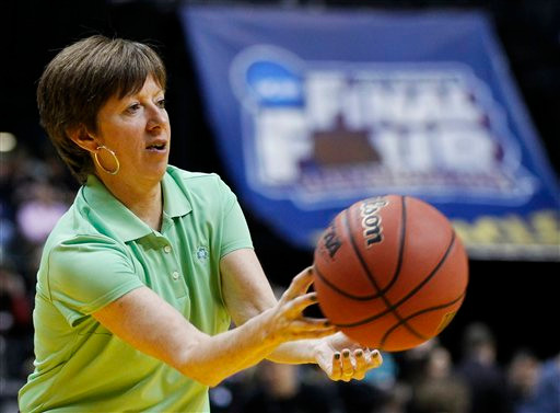 Coach McGraw passes the ball to the Fighting Irish at the one hour workout at Conseco Fieldhouse