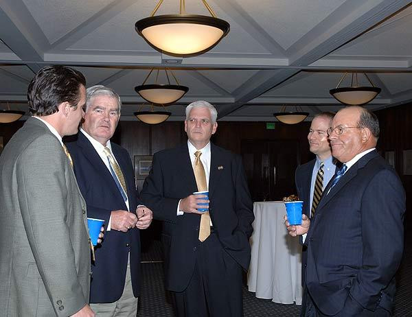 Mike Heaton (left), who serves as the Monogram Club's liason to both football and hockey, spends time with Irish head hockey coach Jeff Jackson (right) prior to the 2005-06 "Drop the Puck" dinner.
