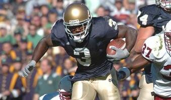 Darius Walker heads upfield during the second quarter.