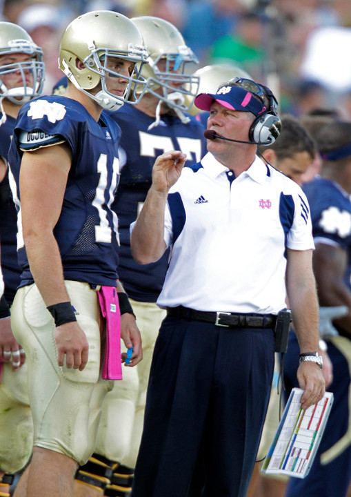 Notre Dame head coach Brian Kelly (right) and senior QB Dayne Crist (left) are set to start fall camp on Saturday, Aug. 6.