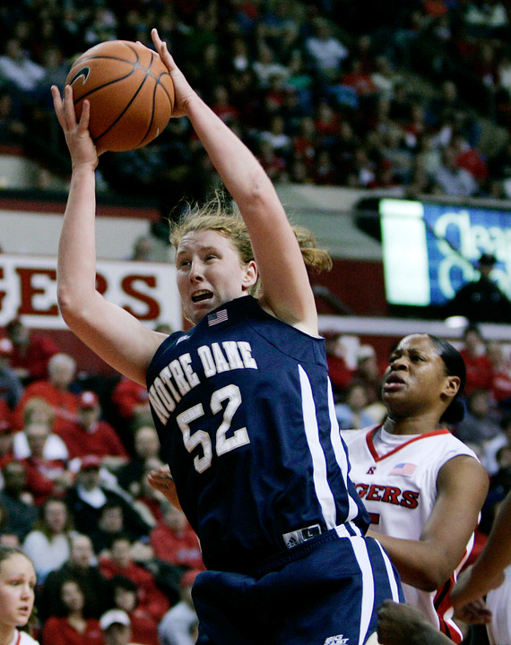 Notre Dame's Erica Williamson grabs a rebound in front of Rutgers' Kia Vaughn in the first half. (AP Photo/Mel Evans)
