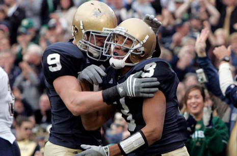 Michael Floyd celebrates with tight end Kyle Rudolph after scoring a touchdown in the second quarter. (AP Photo/Michael Conroy)