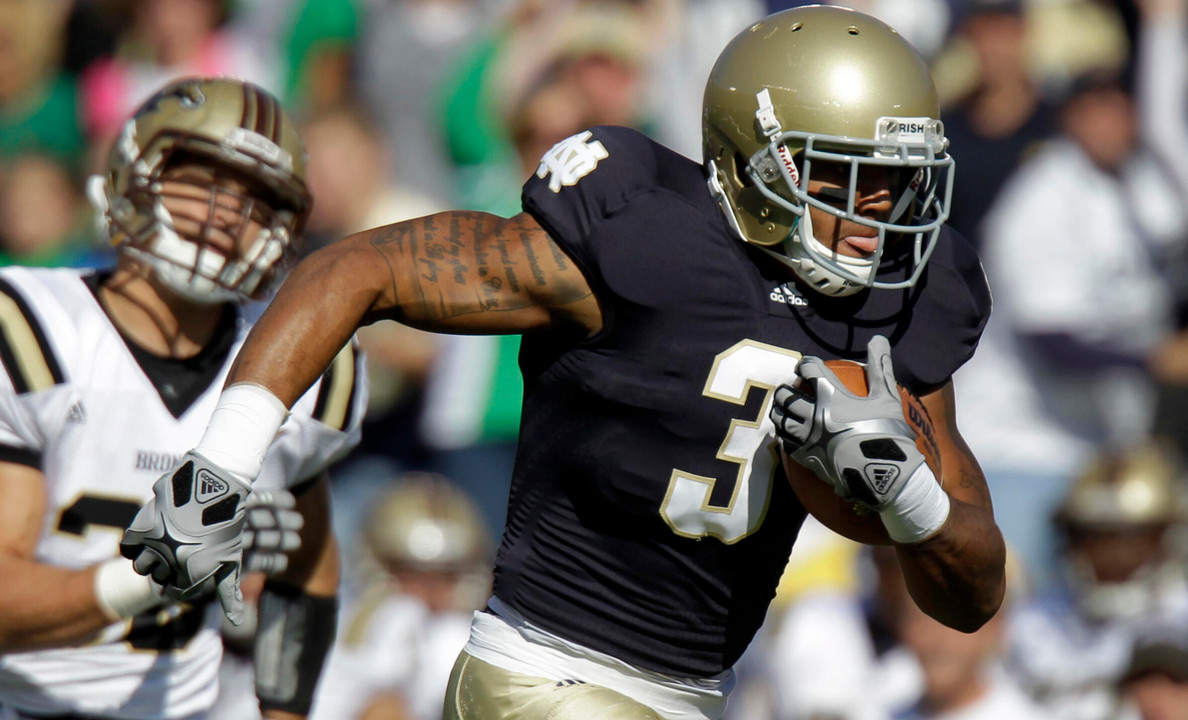 Notre Dame wide receiver Michael Floyd scores on an 80-yard touchdown reception in front of Western Michigan linebacker Chris Prom.